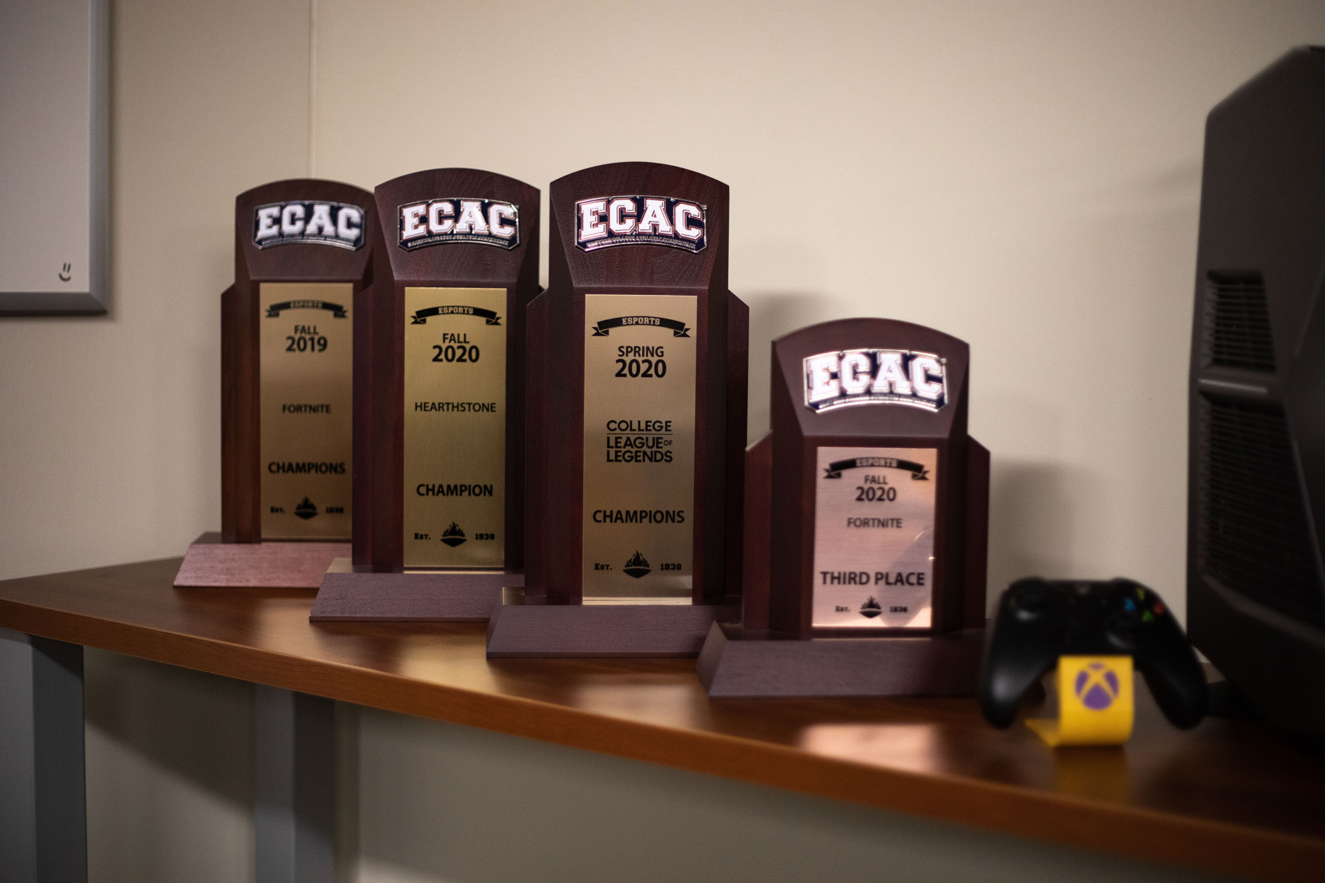 ECAC trophies lined up inside of UAlbany's competitive video gaming arena.