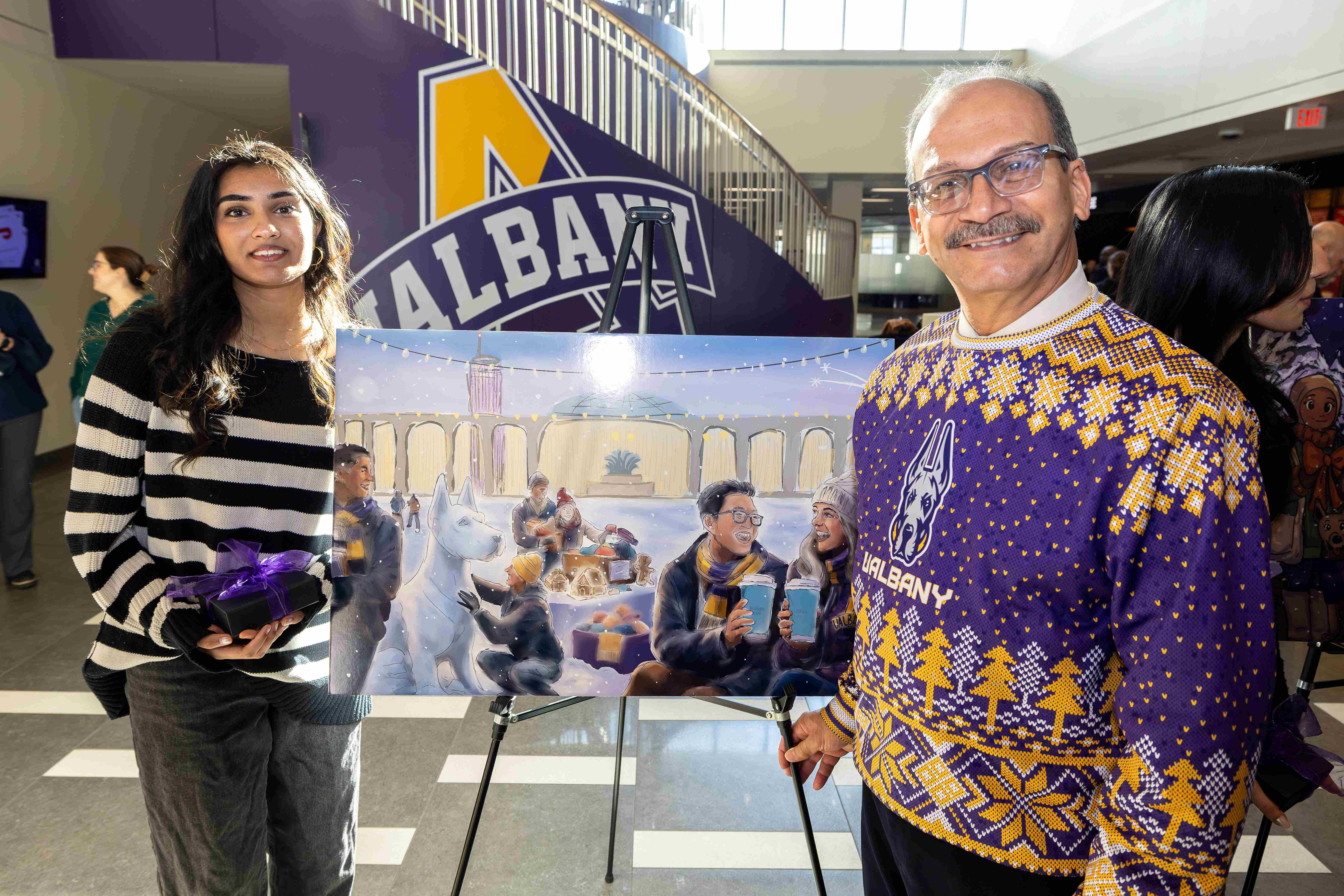 Second runner-up Jadhav's design featured students building a snow dog and enjoying the snow on the podium. (Photo by Patrick Dodson)