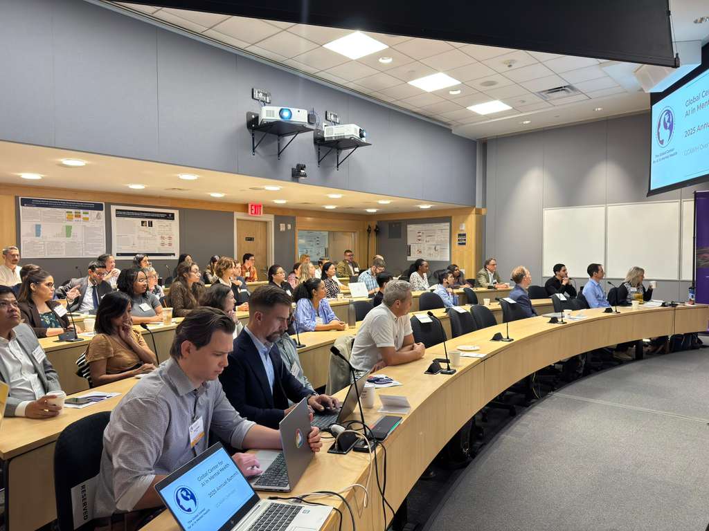 Individuals sitting in a seminar.