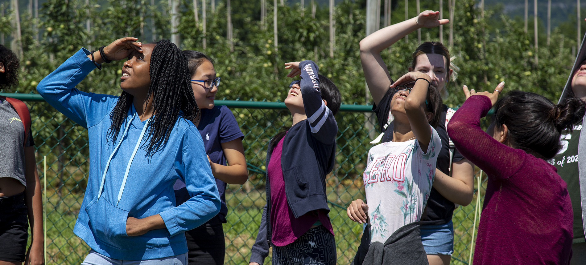 Girls from Schenectady and Albany looking up to the sky at the NYS Mesonet station at Indian Ladder Farm. They came to the UAlbany campus as part of the four-week Girls Inc. EUREKA! Program. Photo by: Brian Busher