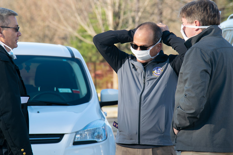 UPD Deputy Chief of Police Paul Burlingame (left), President Havidán Rodríguez and Vice President for Finance and Administration Todd Foreman stand together at the COVID-19 testing site on early Monday morning.