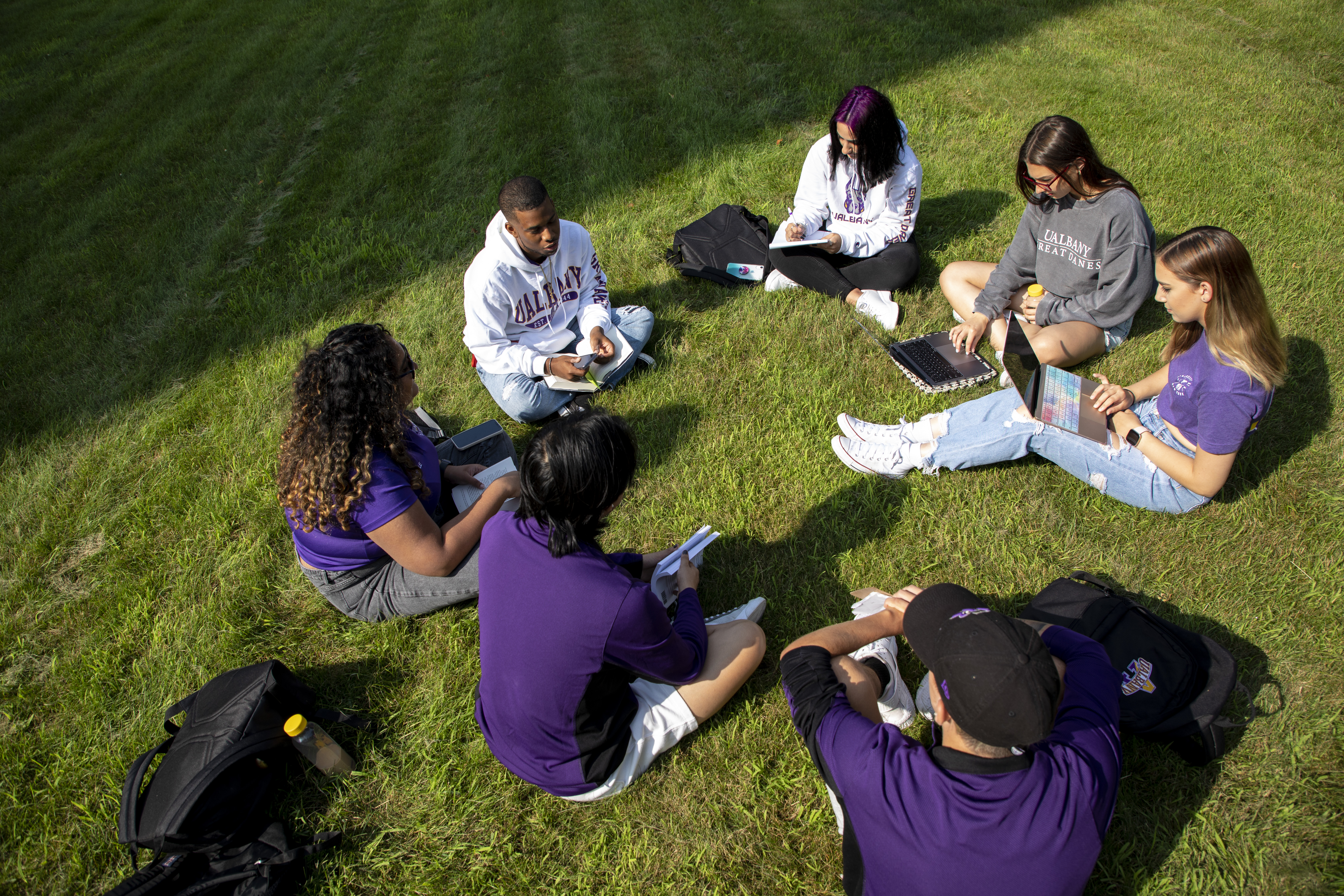 Students gathered in a circle outside to study