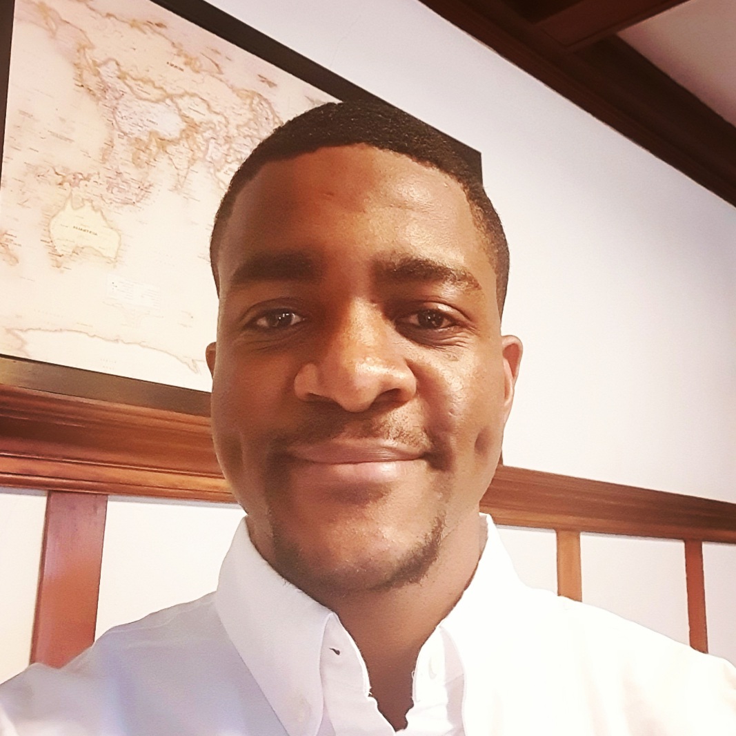 Kenneth smiles at the camera.