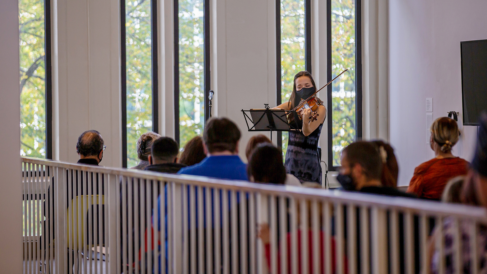 Violinist Emily Daggett Smith performing in the University Art Museum