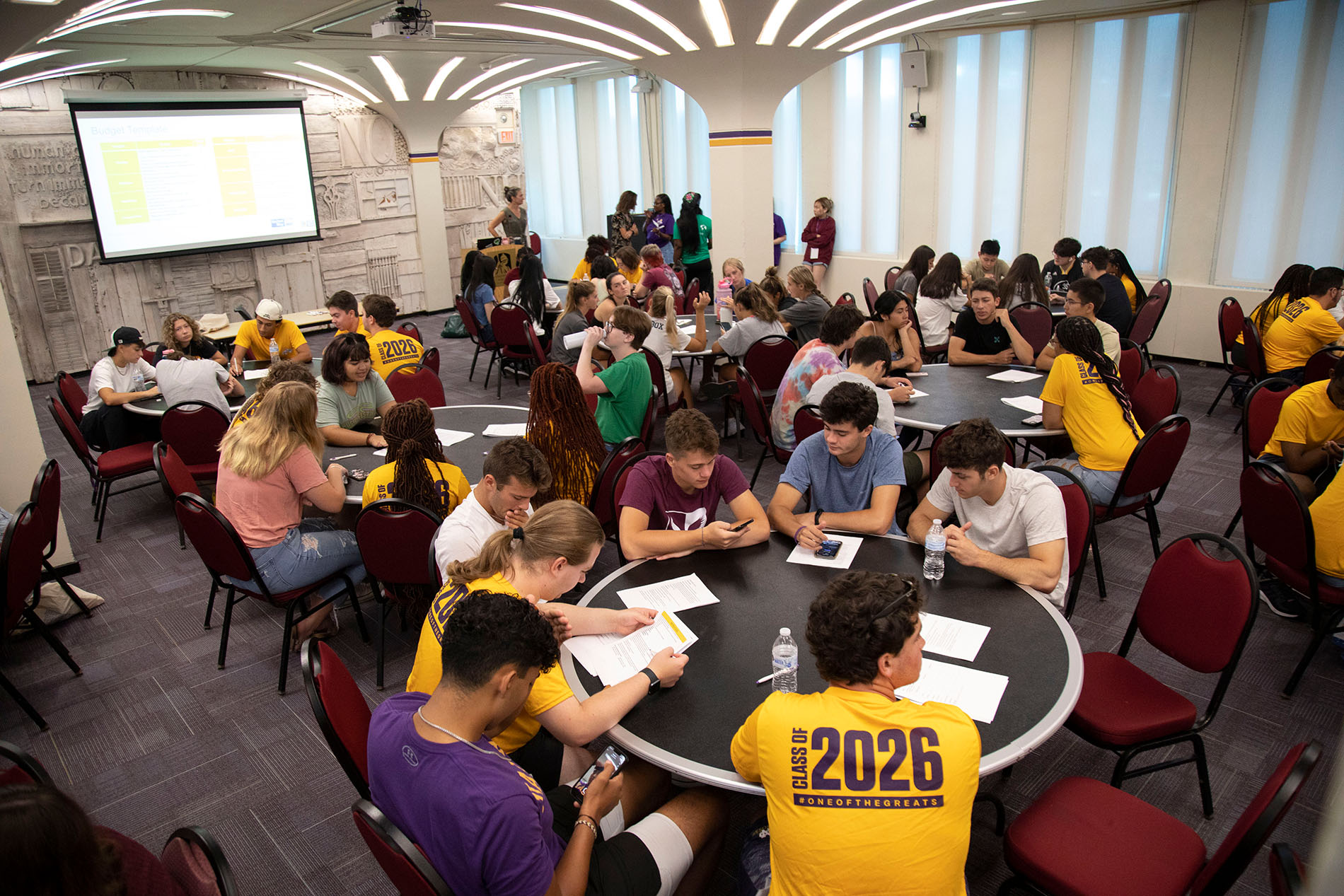 First-year students gather in the Campus Center Assembly Hall through the “17 Rooms of Service” program.