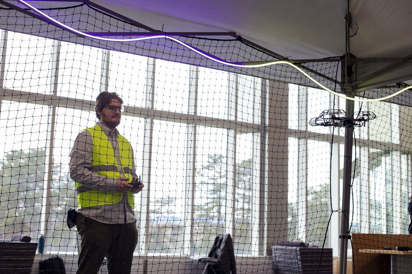 Robert Shepherd flies a drone in the pop-up tent at showcase.