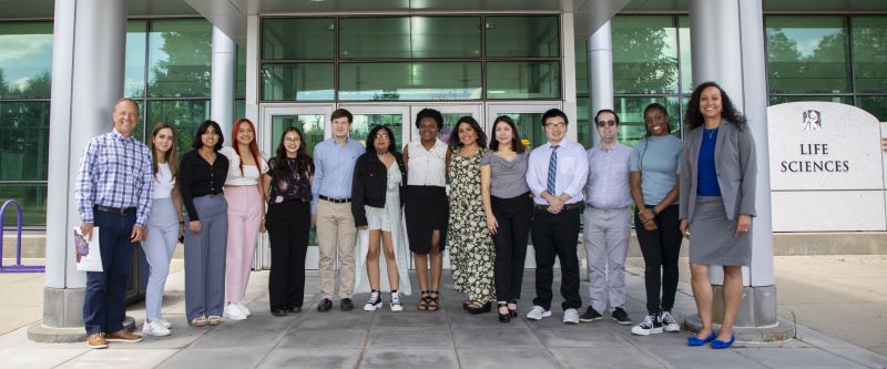 2023 REU in RNA Cohort group photo in front of the UAlbany Life Sciences Building.