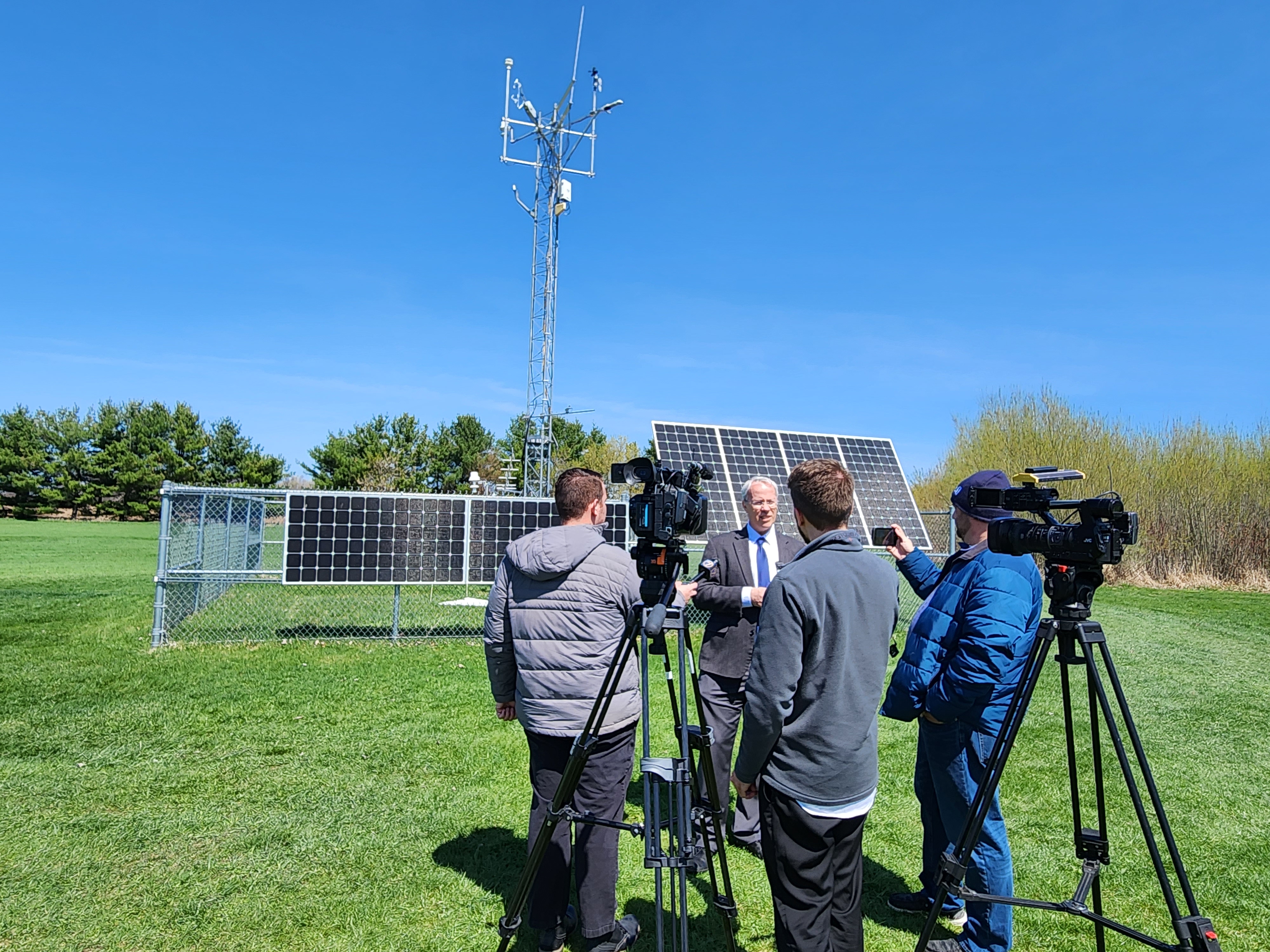 NYS Mesonet Director Chris Thorncroft speaks with reporters in front of the network's Belleville site.