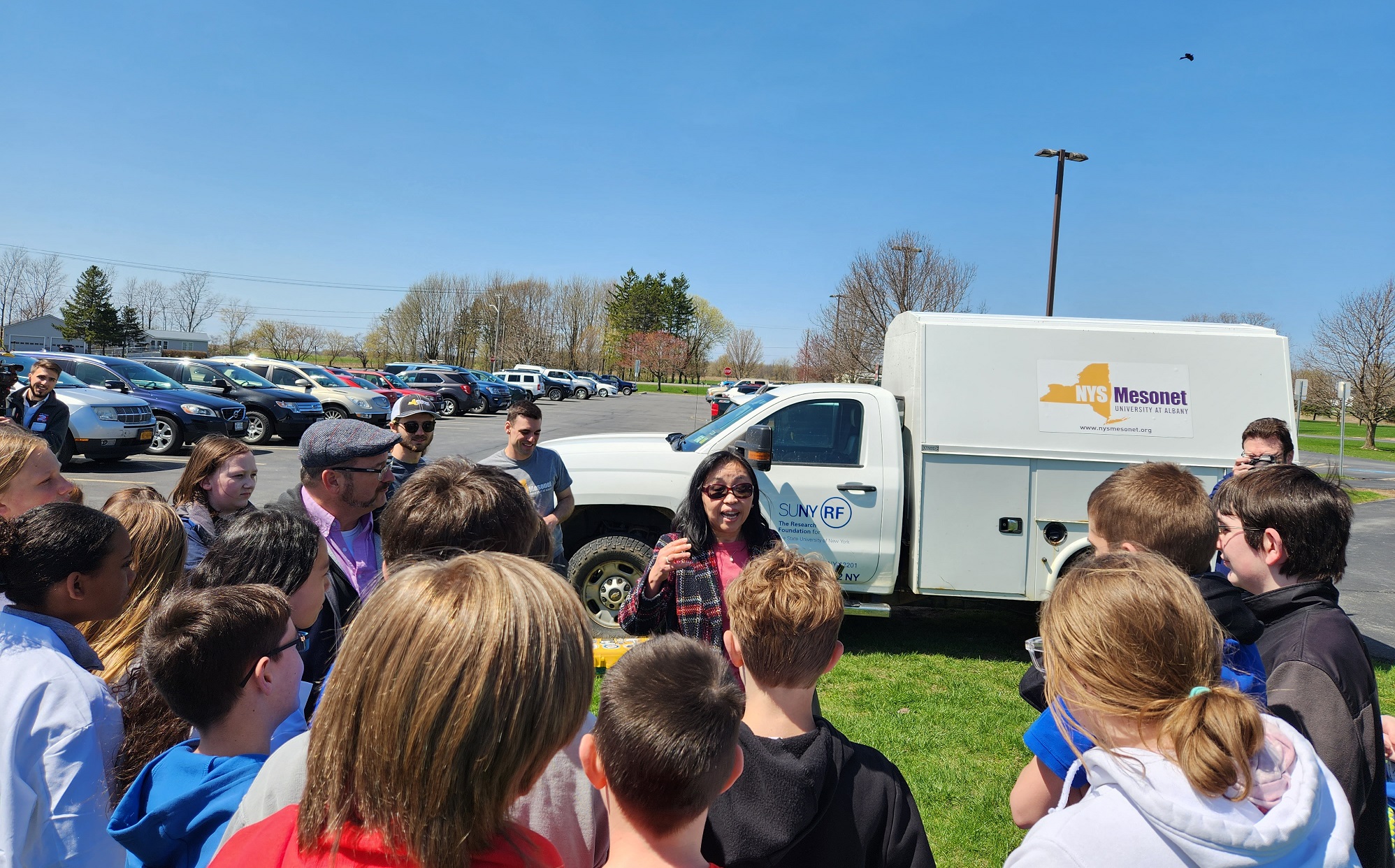 NYS Mesonet Program Manager June Wang speaks with students and teachers at the Belleville-Henderson Central School. 