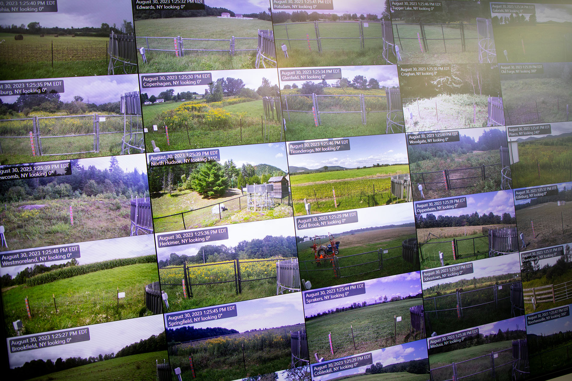 A TV screen displays real time camera images from Mesonet sites across New York.
