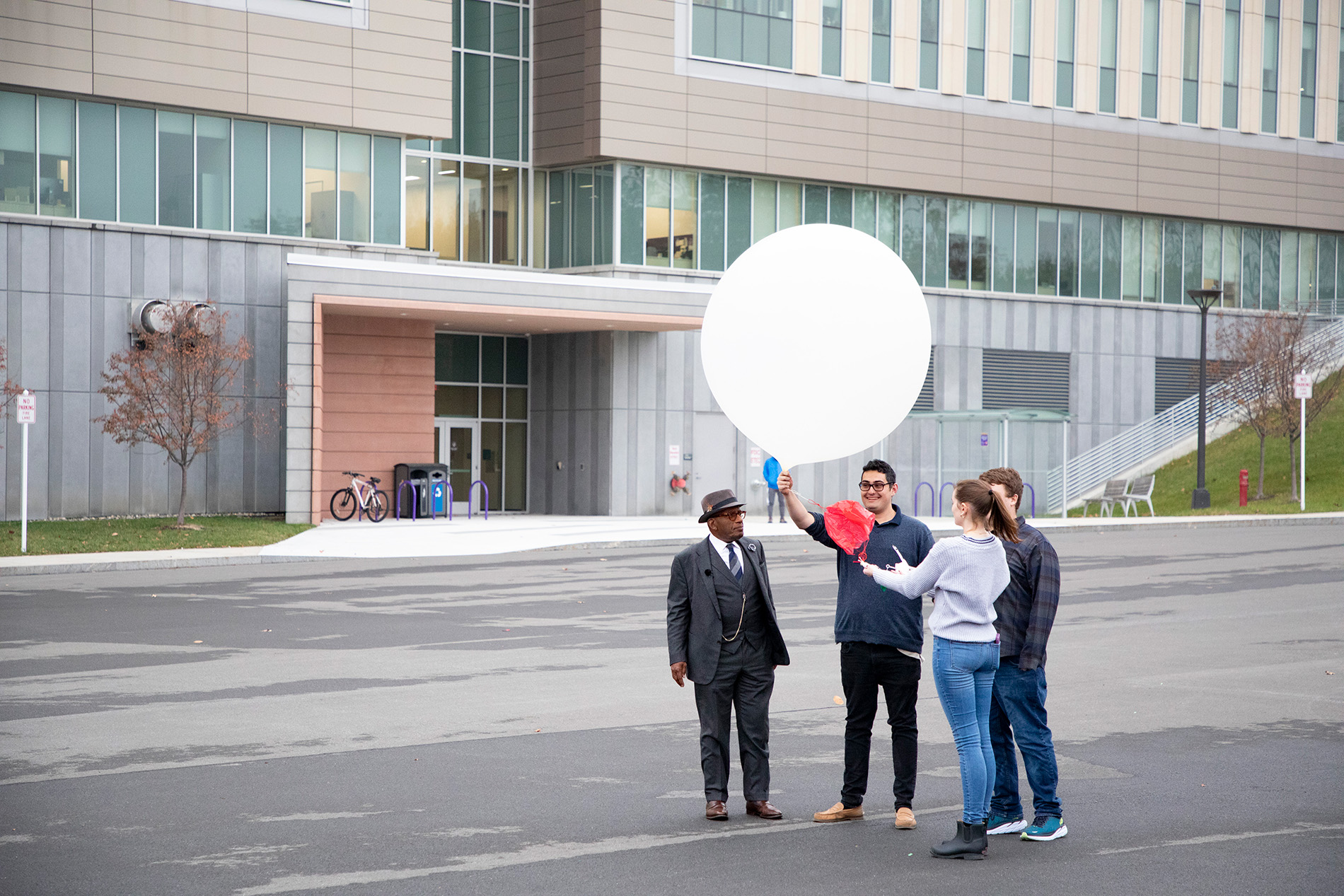 UAlbany students prepare for a weather balloon launch with Al Roker from the ETEC parking lot.