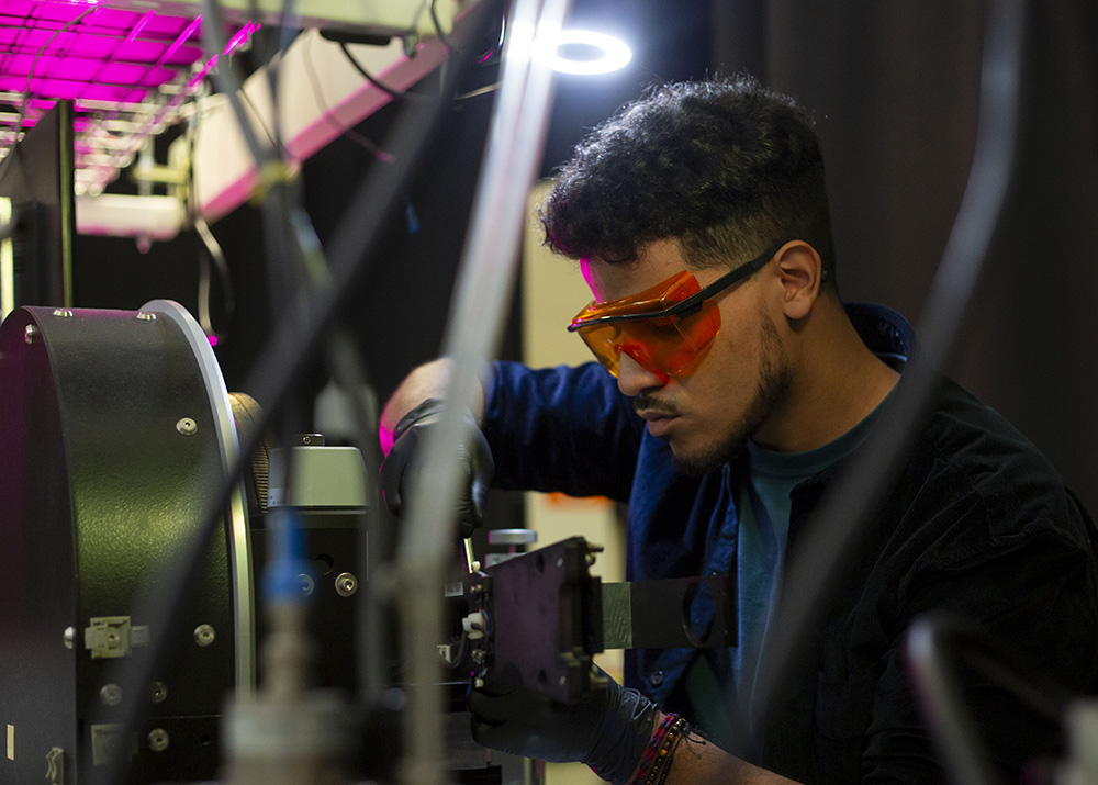 UAlbany Senior Kevin Reyes works in a lab at NYCREATES' Albany NanoTech complex.