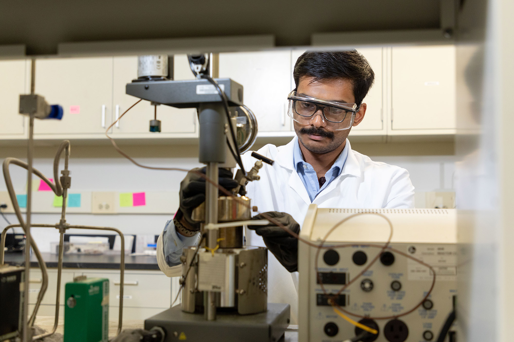 UAlbany PhD Student Sri Saravana Konganapuram Narasimma Bharathi works on a device in the lab of CNSE Professor Kathleen Dunn.