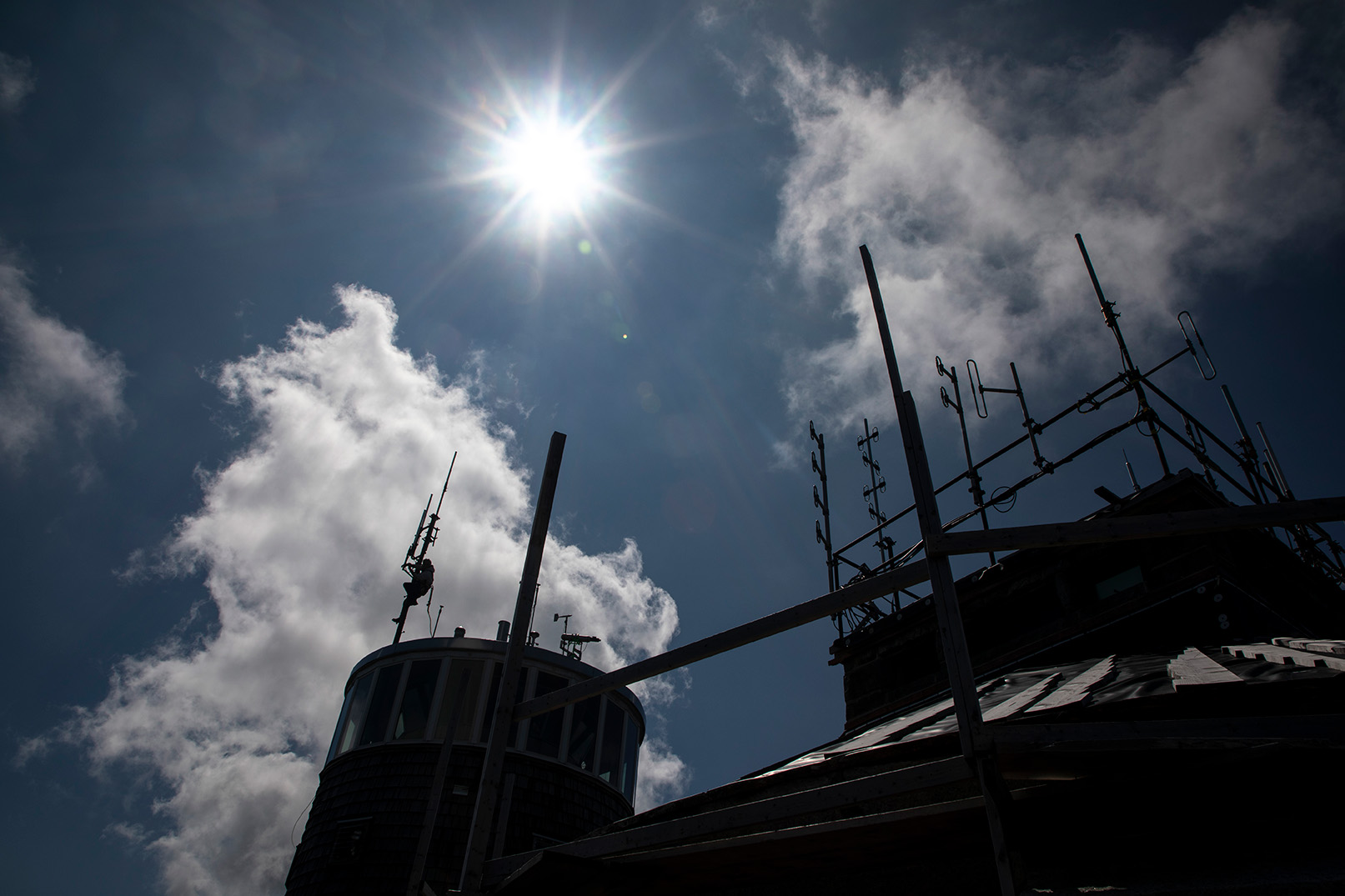 The sun shines over the Whiteface Mountain Field Station atop the summit.