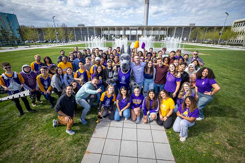 The cast, crew and students involved in filming The College Tour at UAlbany posing with Damien.