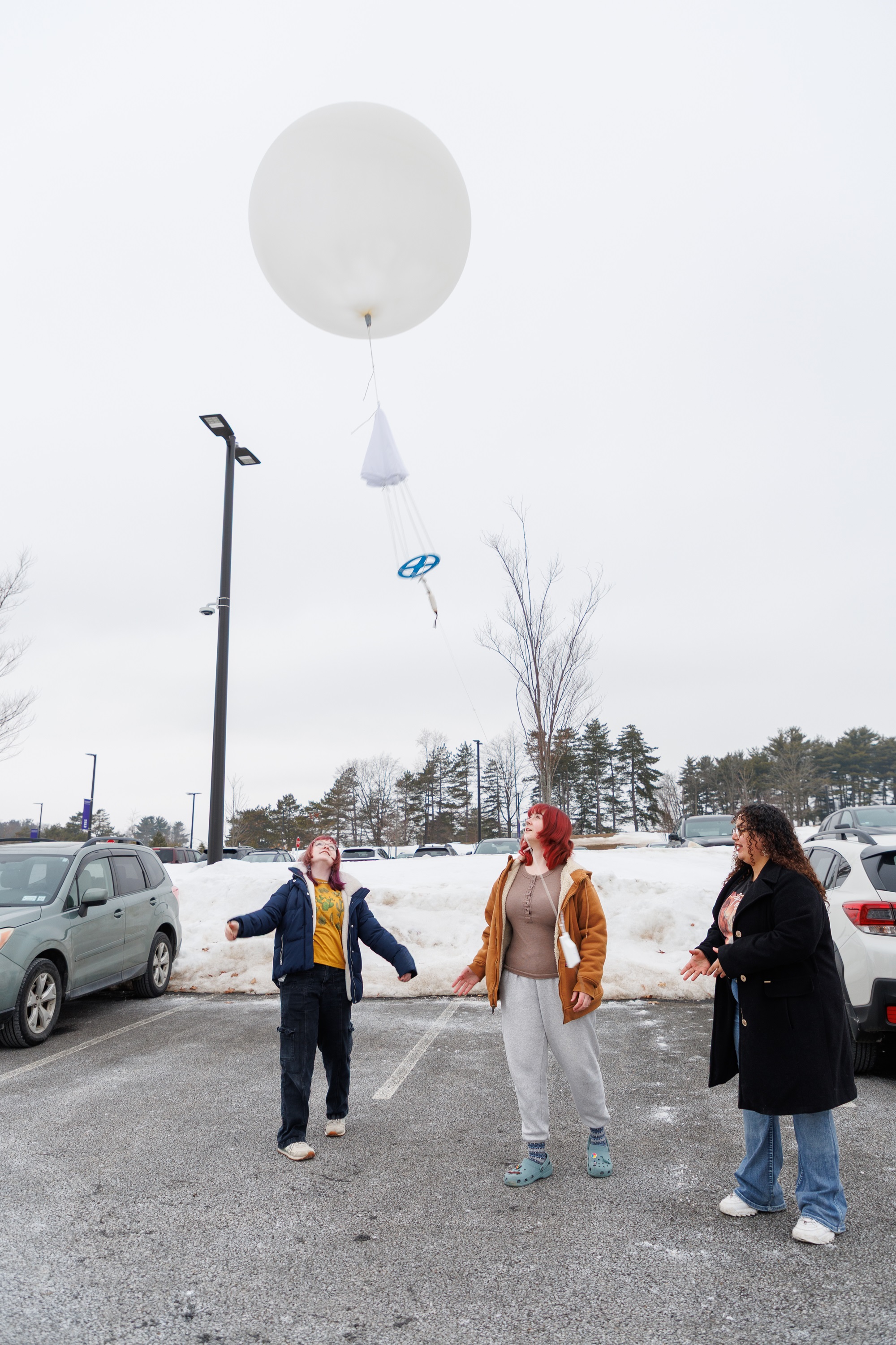 UAlbany students launch a weather balloon from the ETEC parking lot.