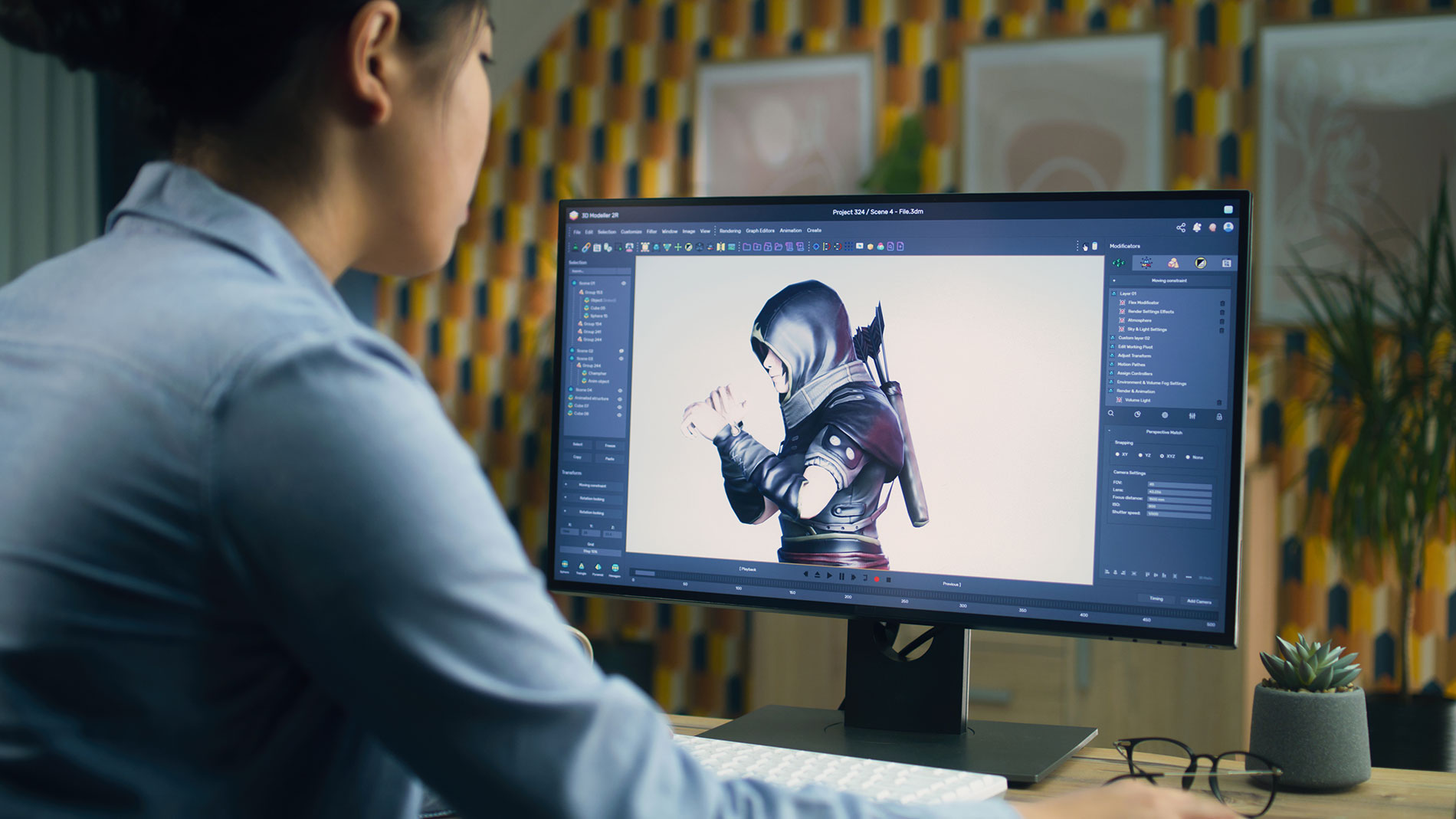 A video game designer works on a character model on a monitor.