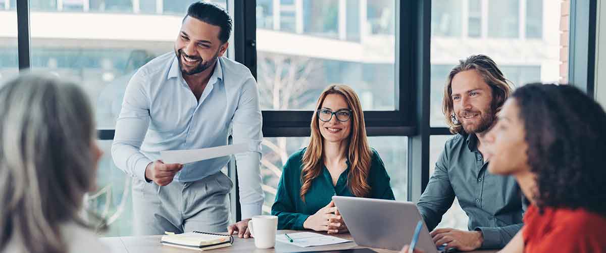 A team leader conducts a meeting in a conference room.
