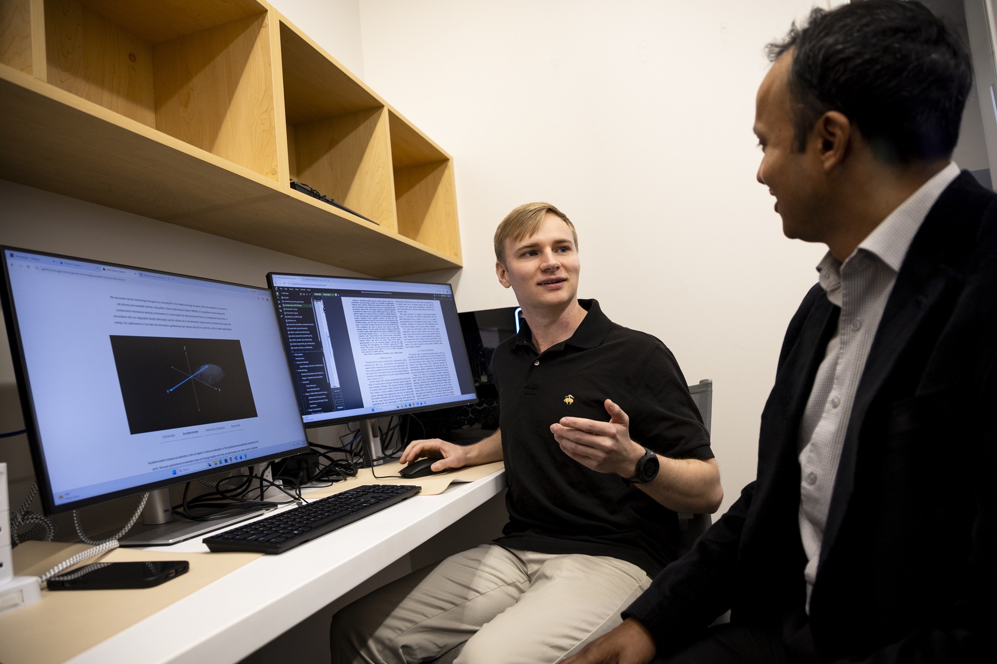 Stephen Gravereaux meets with his mentor Sheikh Islam at the Cognitive-Security, Accountability, Fairness and Explainability (CAFE) Lab,