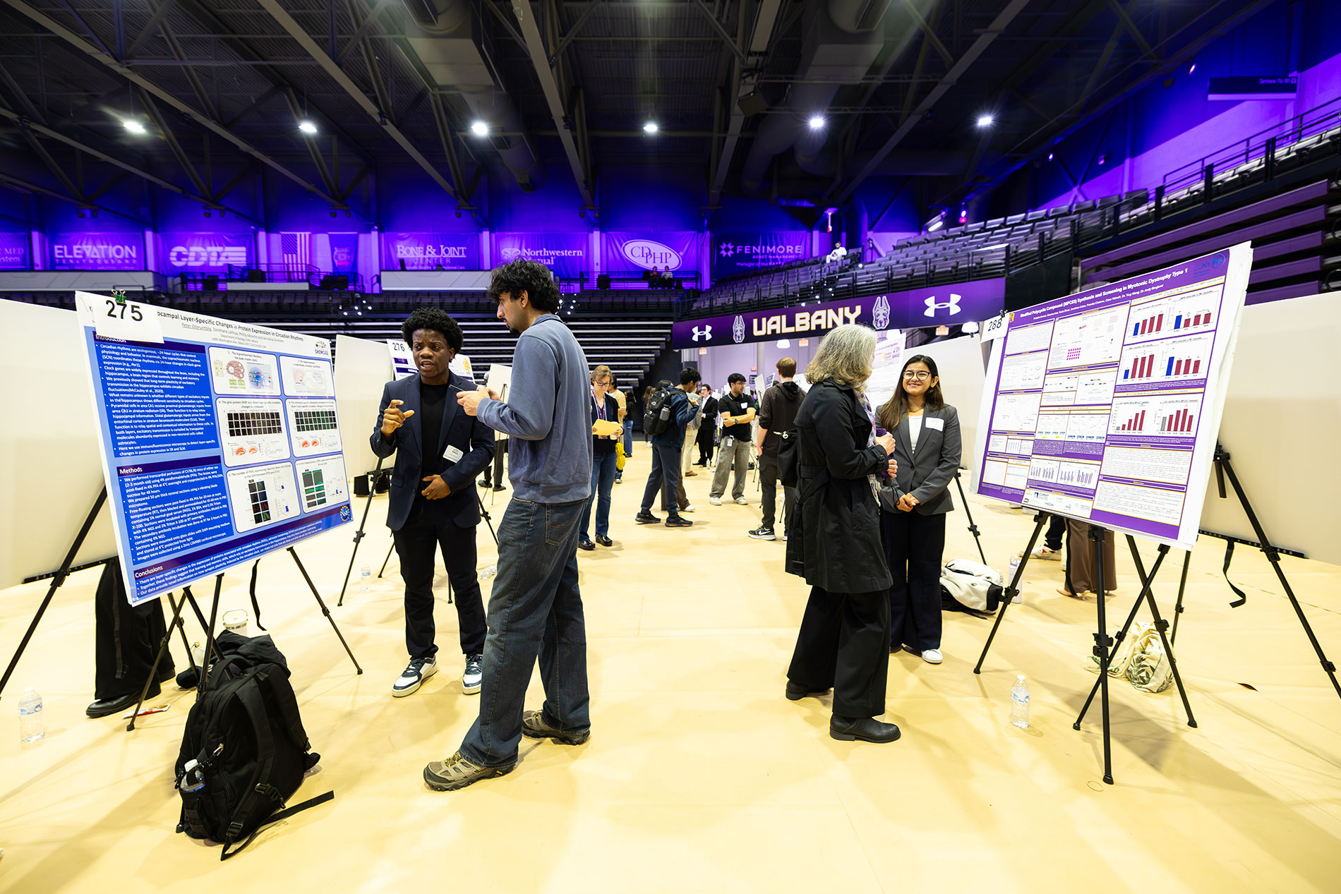 Students presenting research posters in the Broadview Arena during Showcase Day.