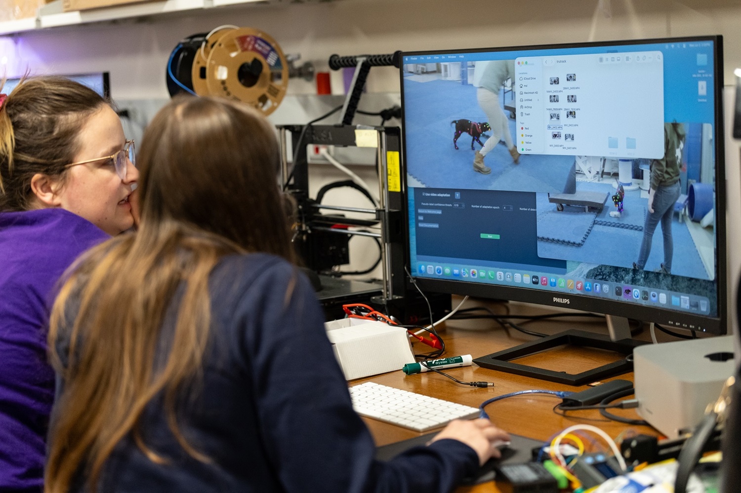 Students work with research staff inside UAlbany's Mobile Sensor Lab to identify and track canine movements on a treadmill.
