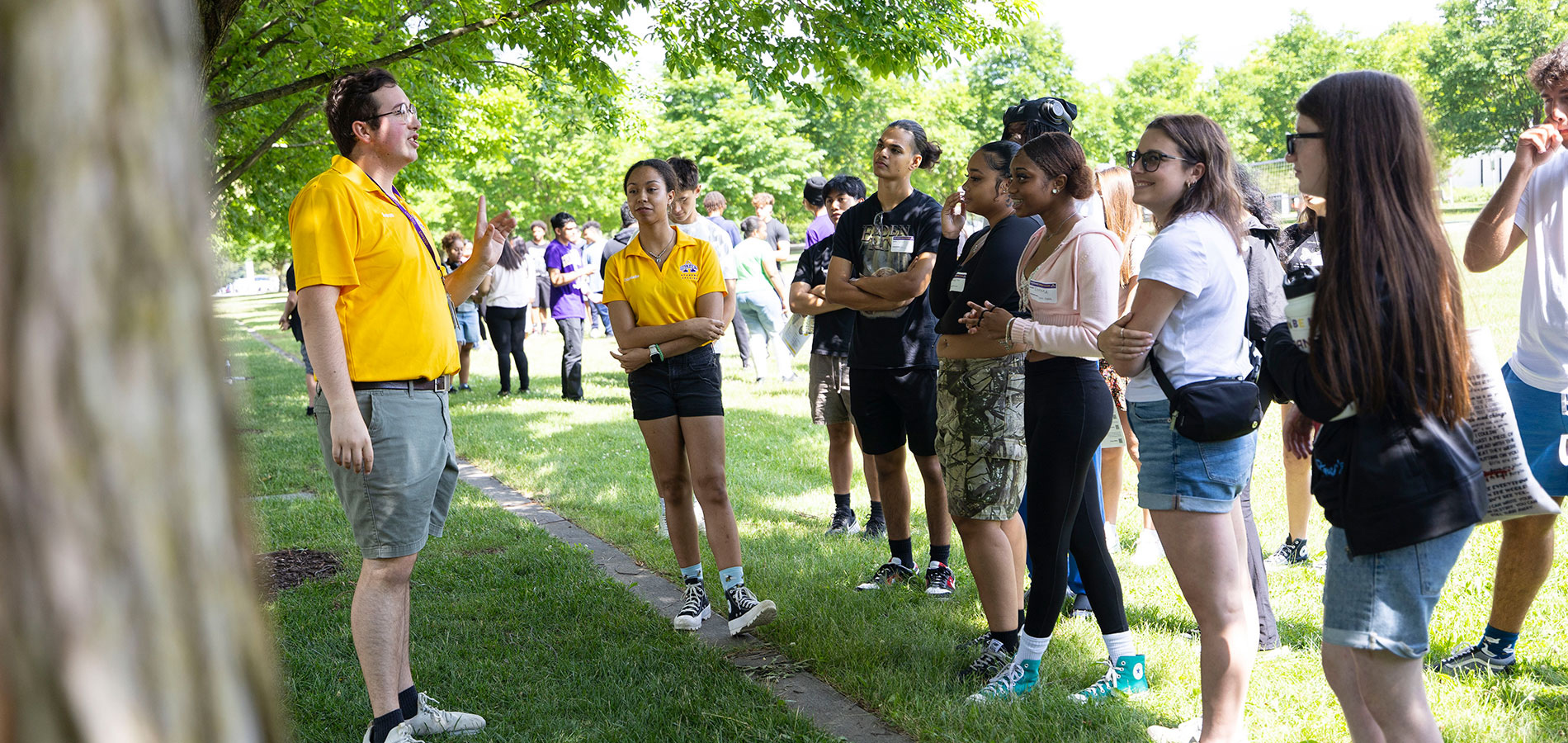A group of new UAlbany students talking with their Orientation leaders.