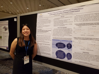 Melissa Anderson with her poster projects at APS 2025.