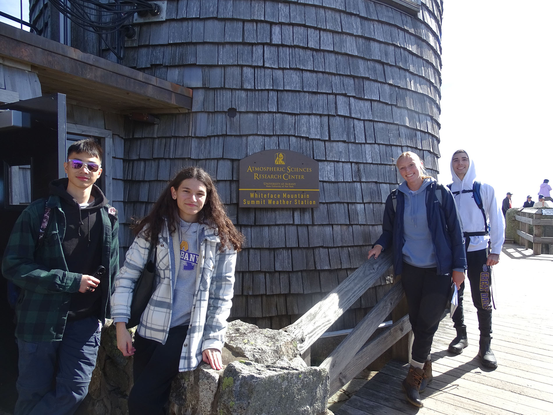 UAlbany students stand outside the Whiteface Mountain Observatory.