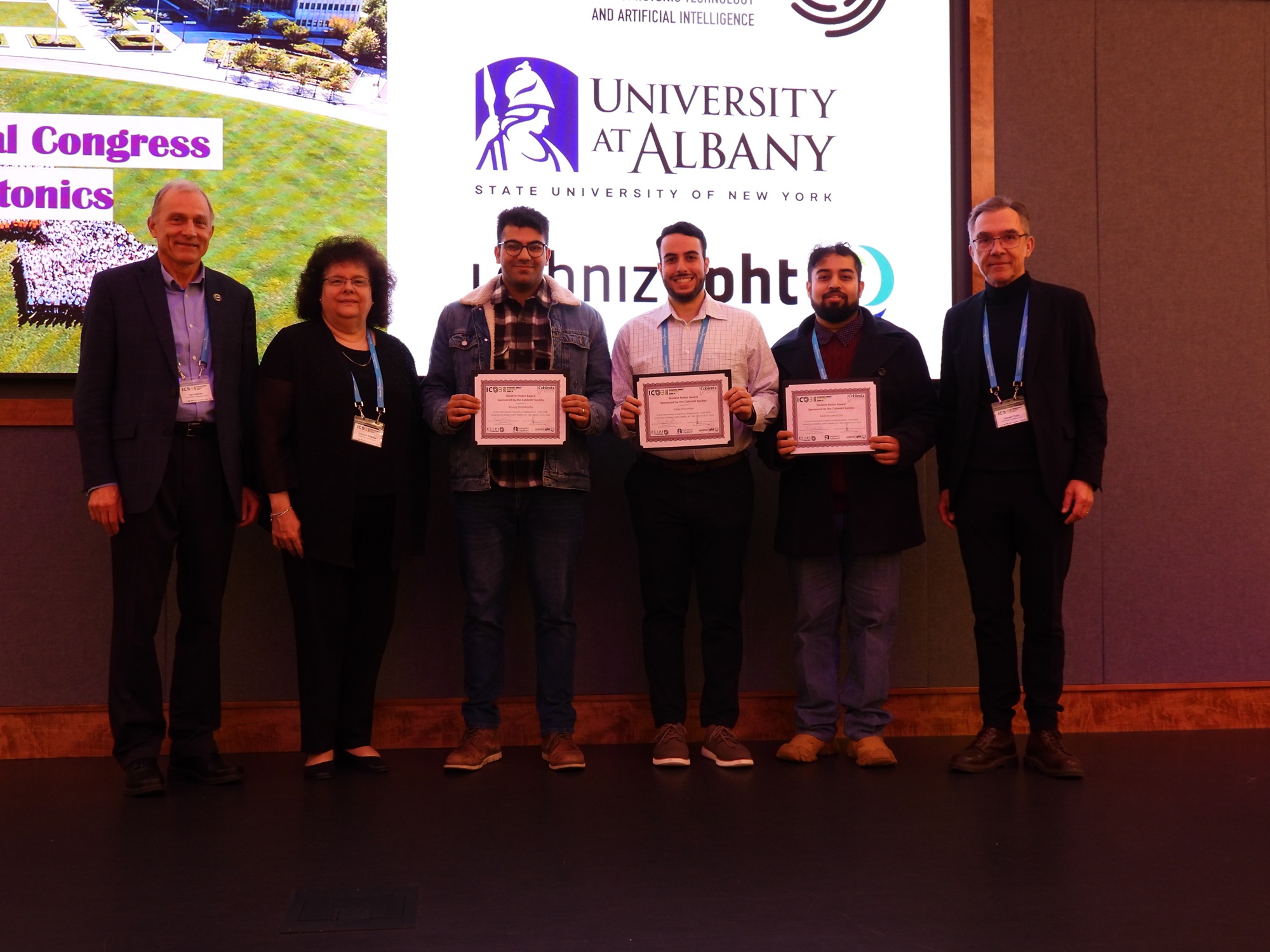 UAlbany students are presented with awards for their posters at the the International Congress on Biophotonics.