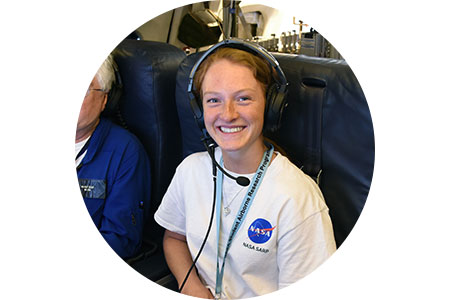 Erin wearing headset and NASA t-shirt.