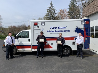 Five Quad students stand in front of their ambulance at Nanuet.