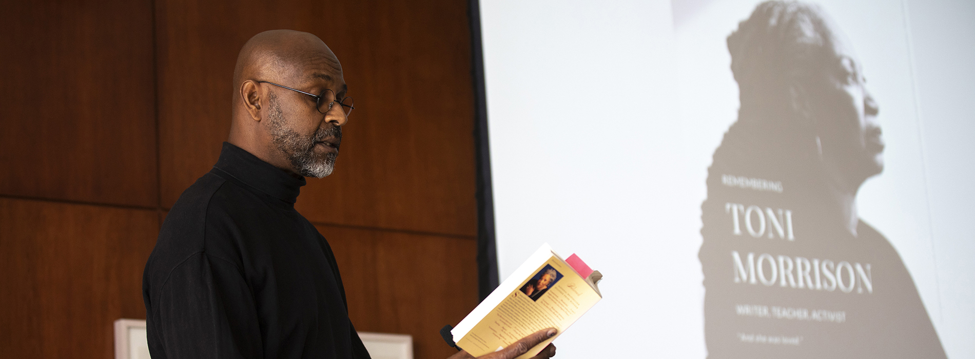 English Professor Glyne Griffith reads to the audience at the Toni Morrison Tribute, Nov 1, 2019 (Photo by Patrick Dodson)