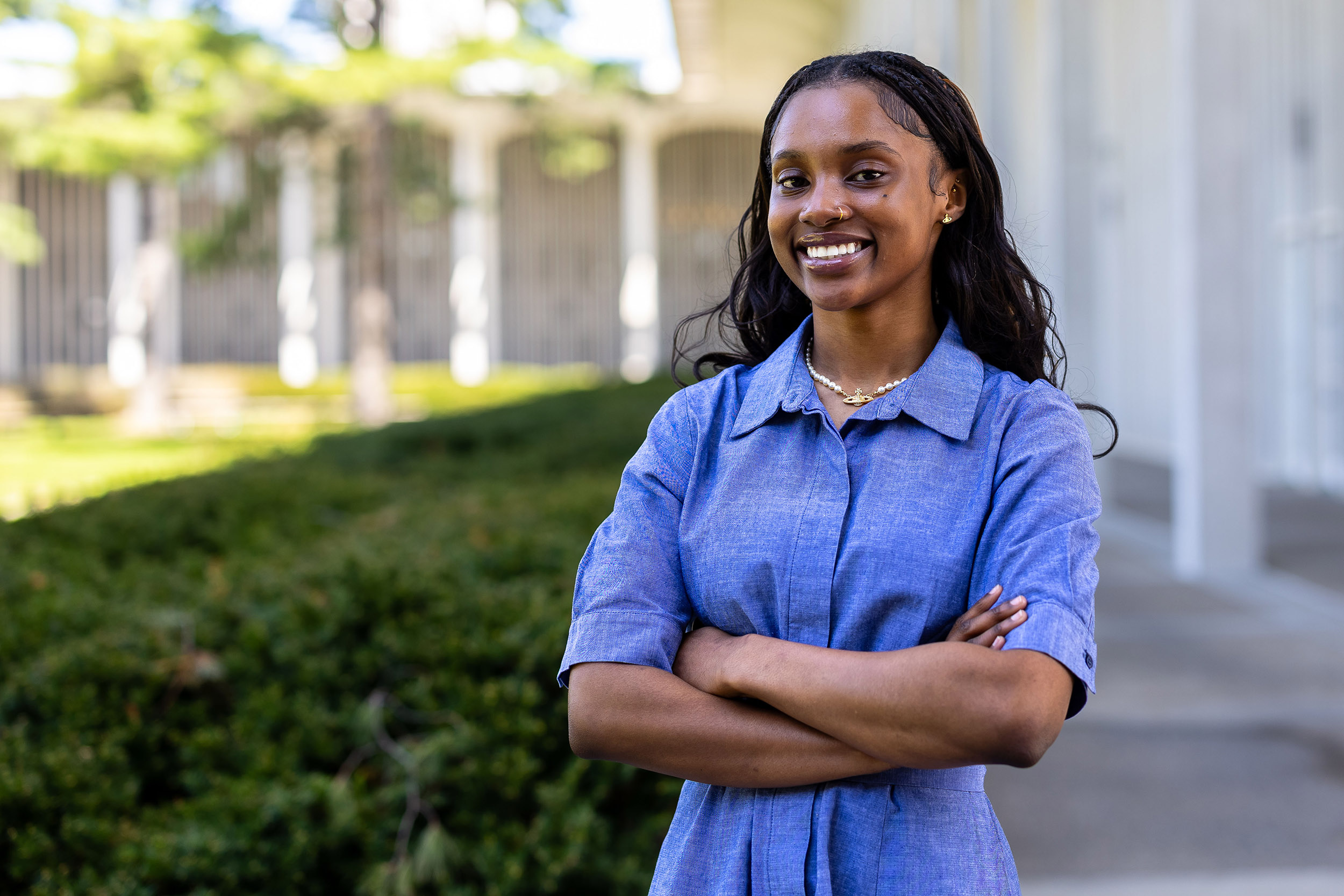 A potrait of UAlbany student Halimah Lawson as she stands on the academic podium outside