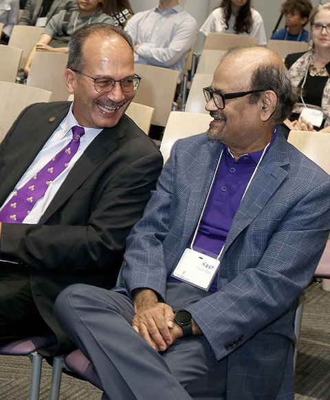 President Havidan Rodriguez and Vice President for Research and Economic Development Thenkurussi (Kesh) Kesavadas listen to presentations at S4 Demo Day on Aug. 9.