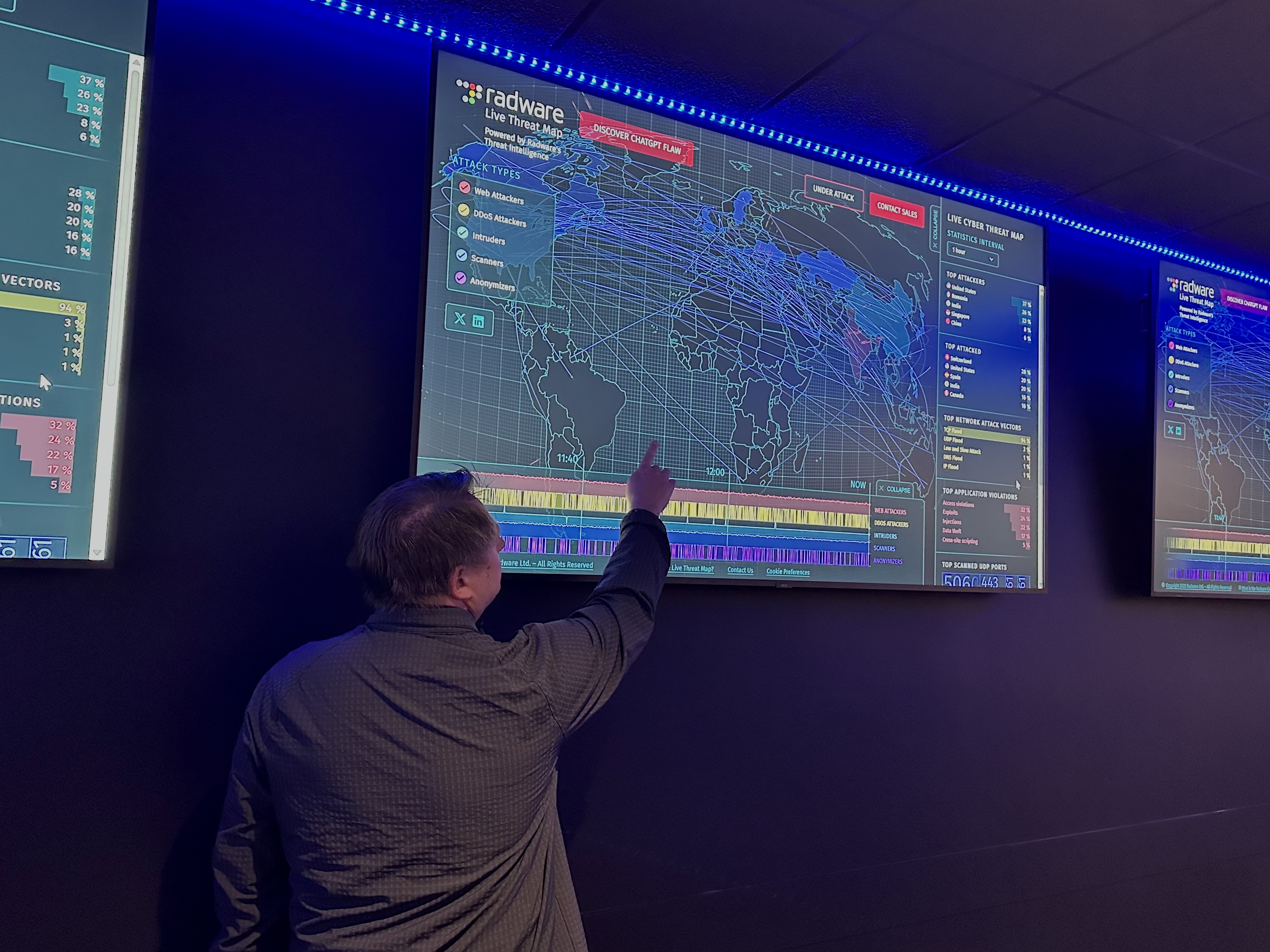 Center of Internet Security's Sean Atkinson points to a map in the Cyber Range lab.