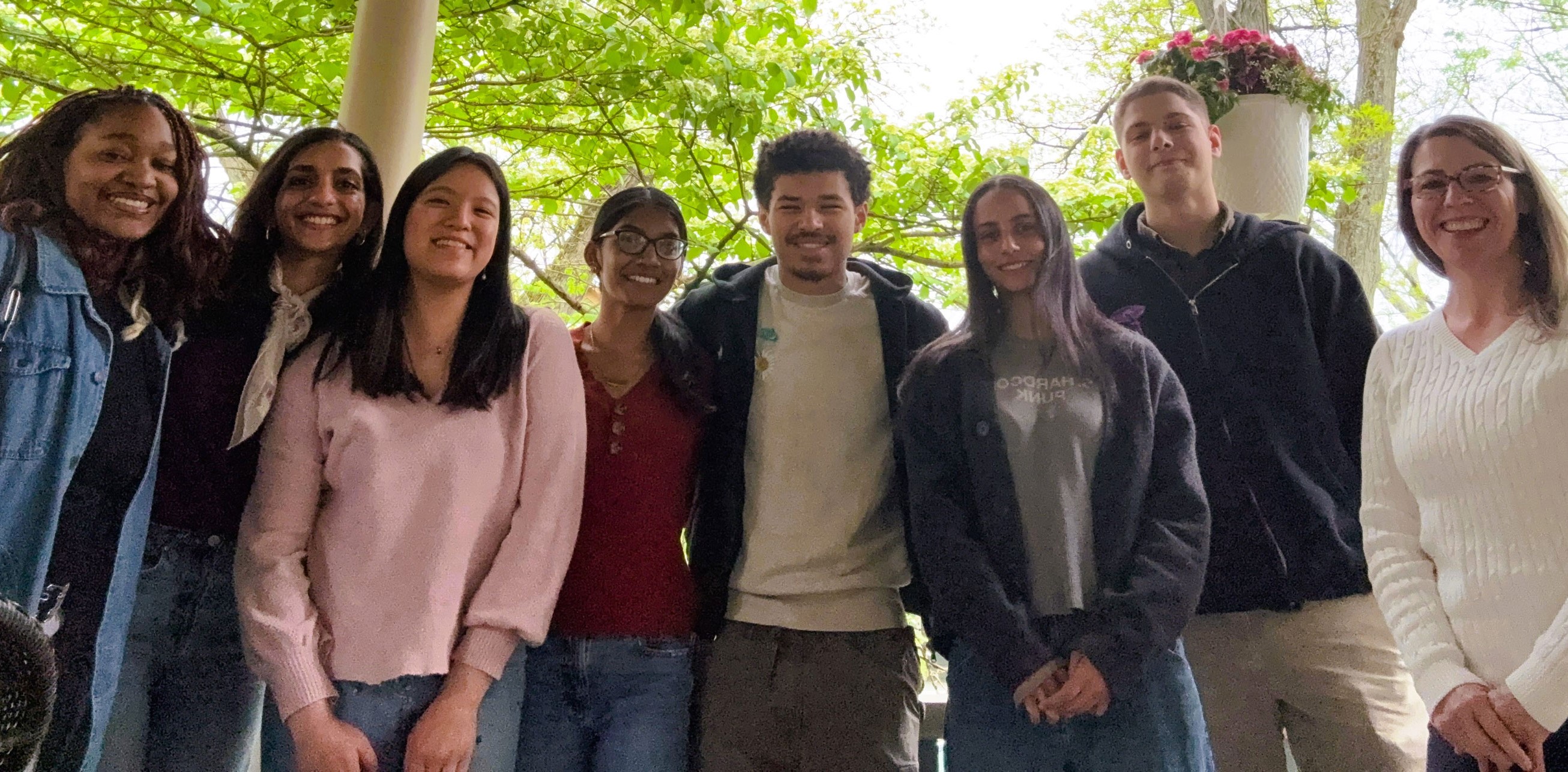 An image of seven PULSE Lab students standing next to each other and Professor Najdowski is standing on the far right.