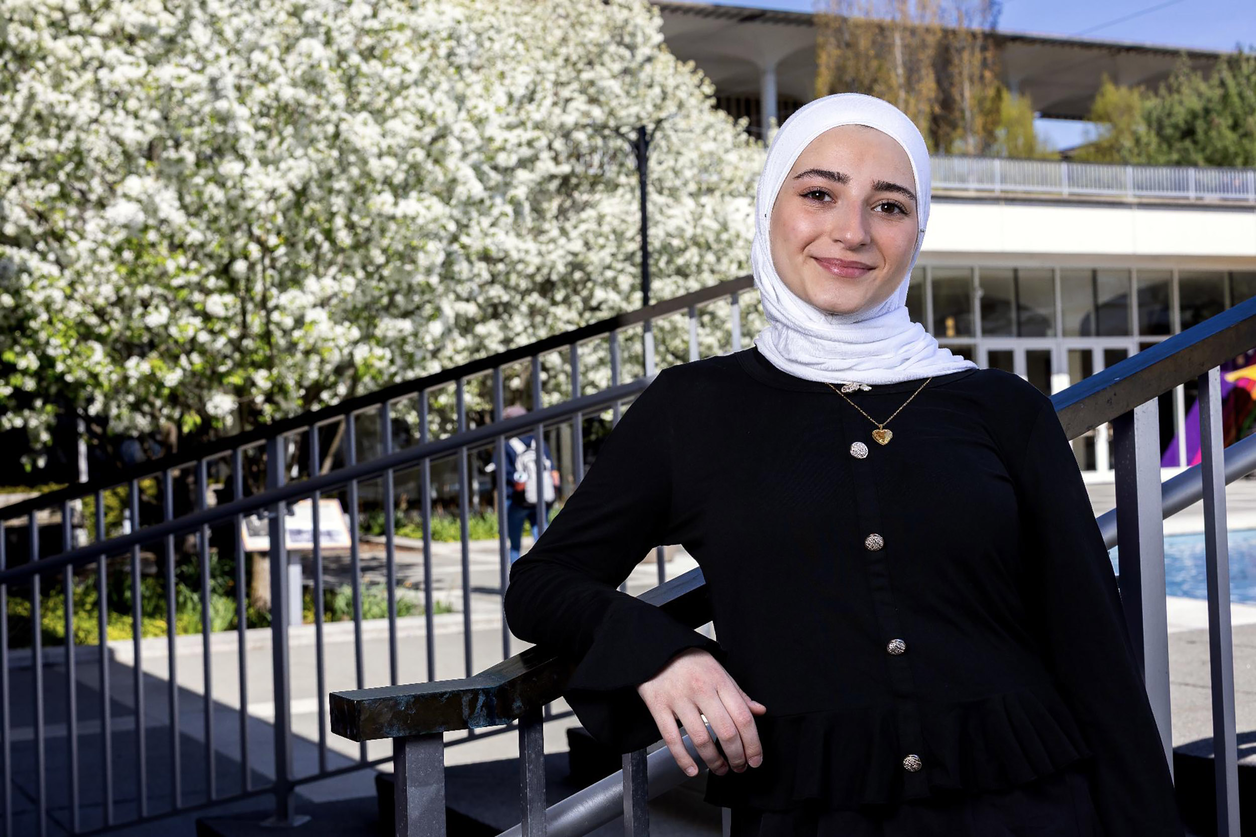 A potrait of UAlbany student Massa Masri outside near the main fountain