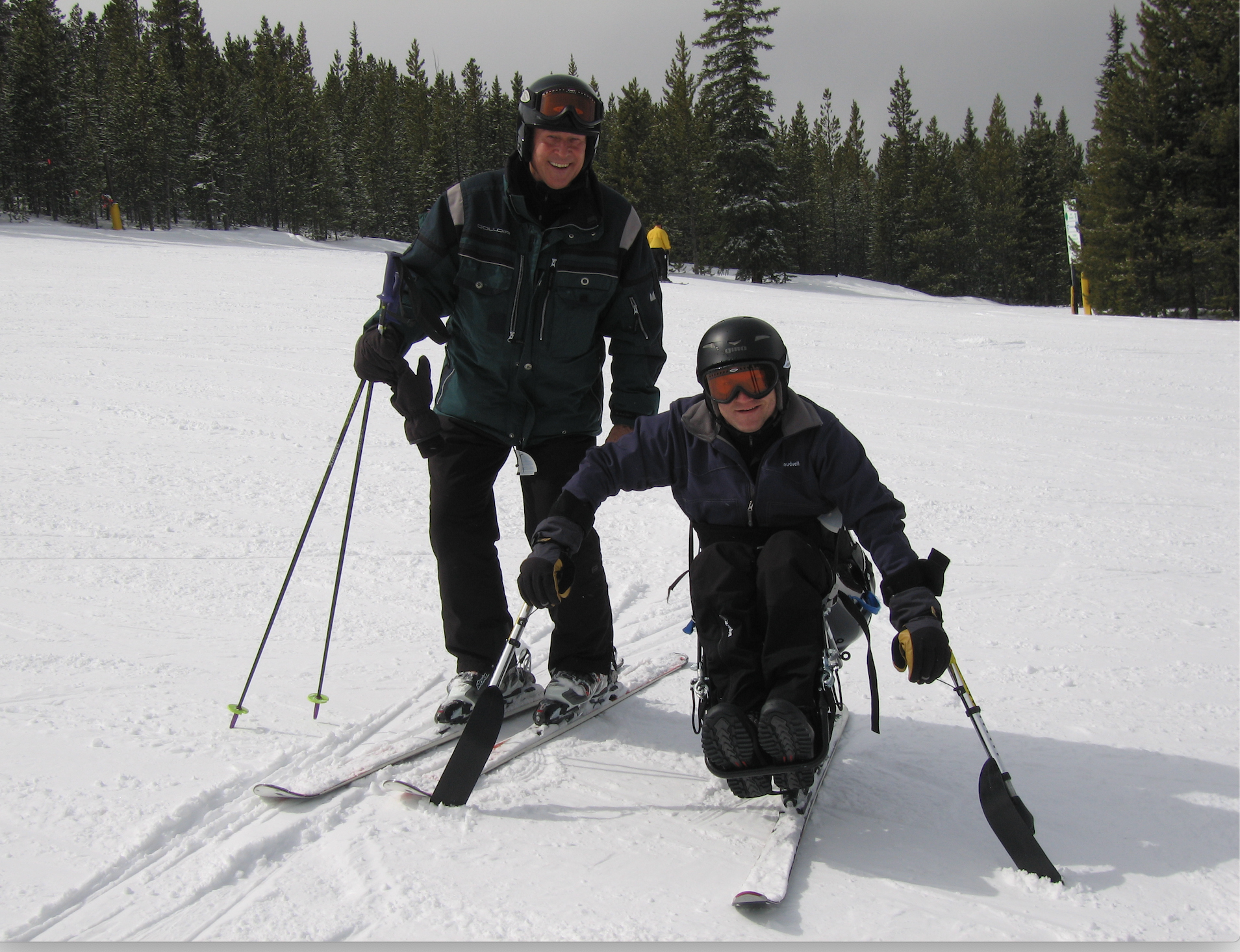 Ron Forbes skiing with son
