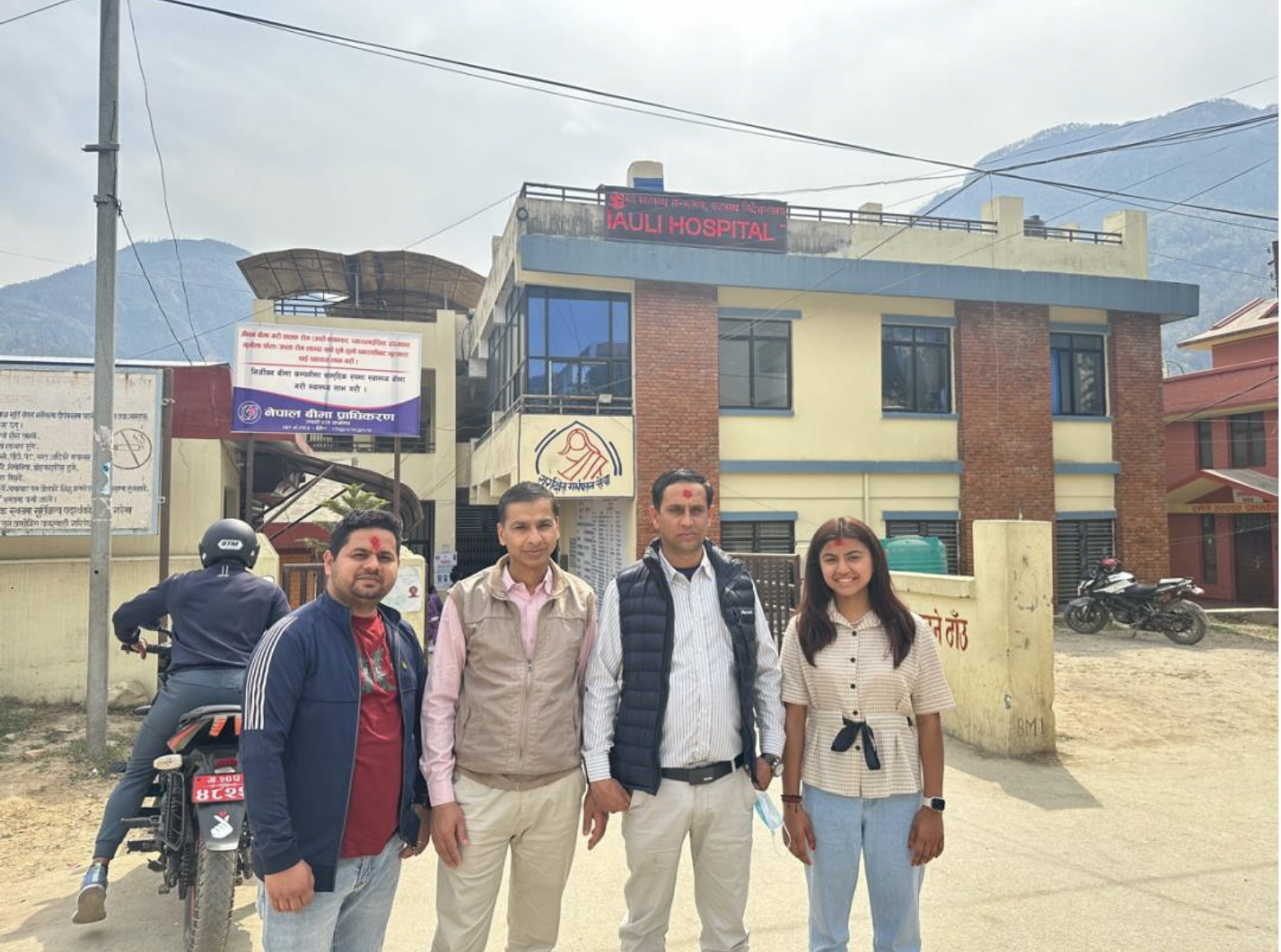 Labika and her mentors in front of a hospital in Nepal.