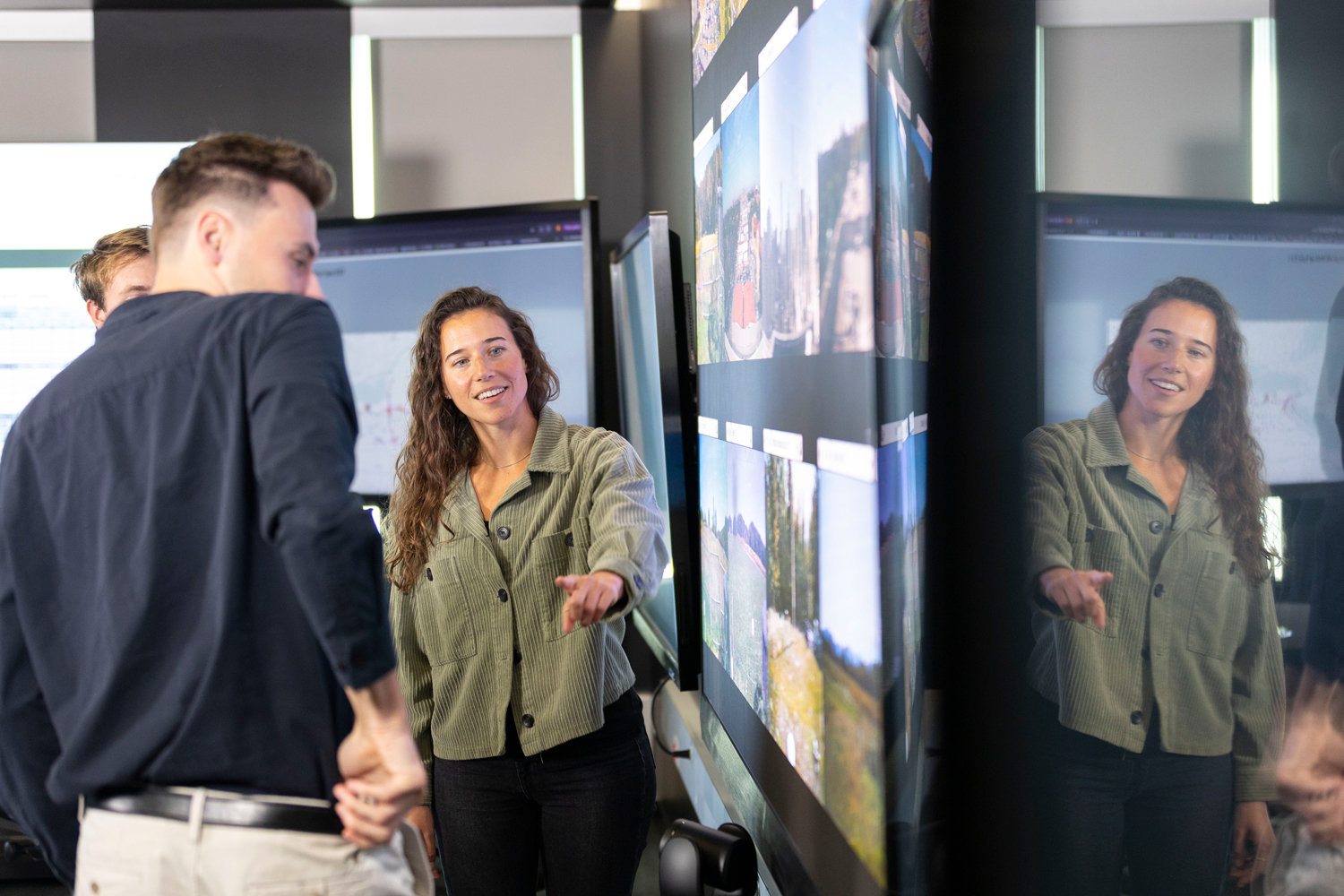 Carly Sutter observes real time camera images of New York State Mesonet sites from inside UAlbany's xCITE lab.