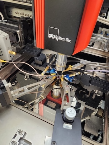 Advanced equipment labeled Suss Microtec is shown in a laboratory setting.