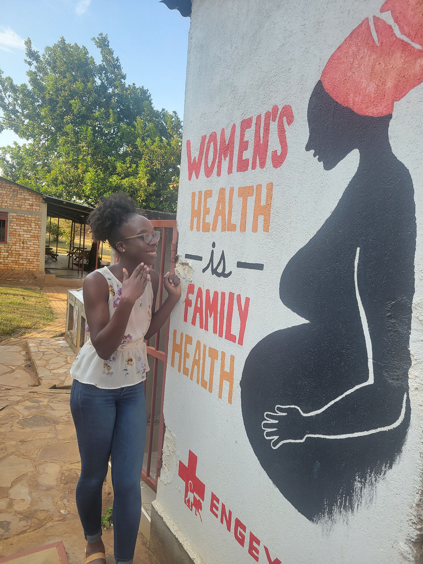 Zari Ward stands outside the Women's Health Clinic at Engeye.