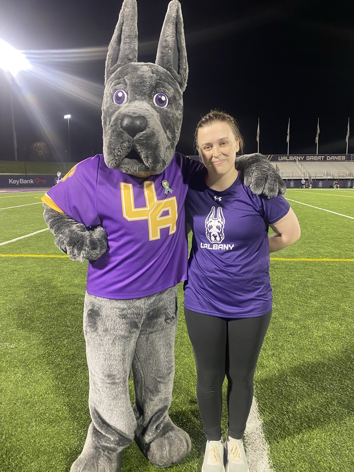 Zoe Veaunt stands next to Damien on Bob Ford field.