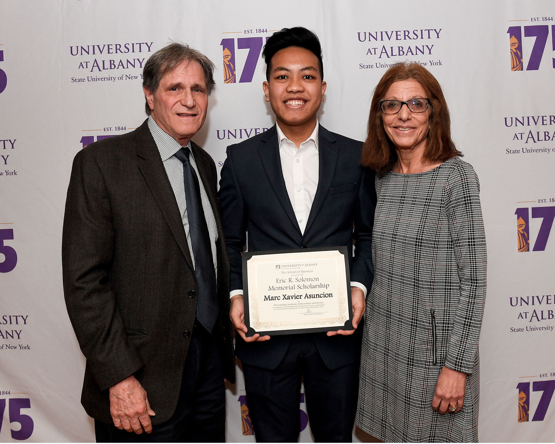 Marc Xavier Asuncion receives the Eric R. Solomon Memorial Scholarship from the Solomon Family