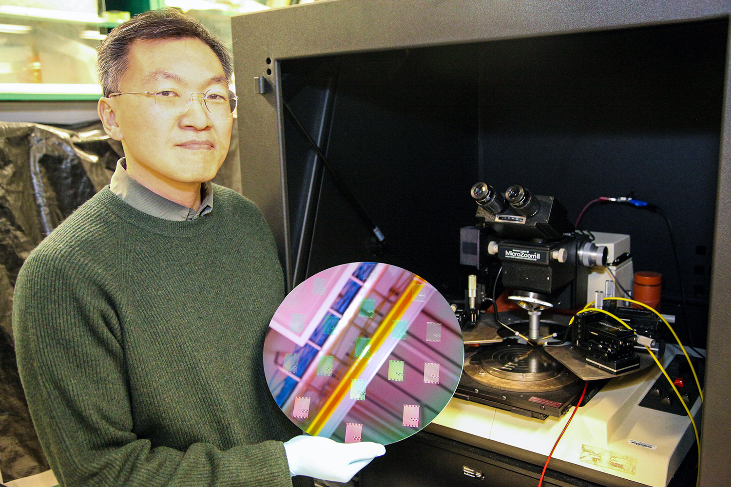A UAlbany nanotechnology researcher holding a wafer.