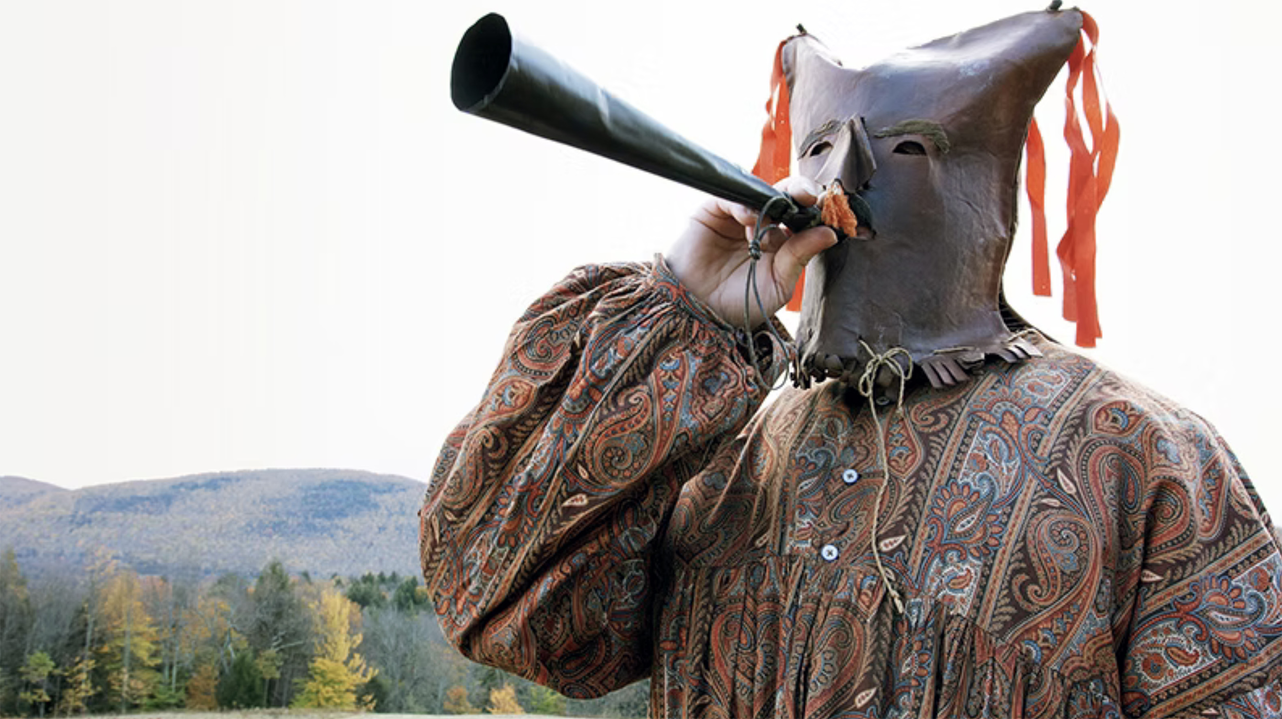 A man from upstate New York wears a traditional costume from the Calico Rebellions of the 1840s outdoors in the Hudson Valley.