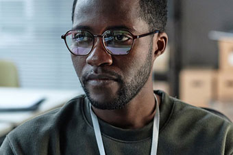 A cybersecurity analyst works in an office.