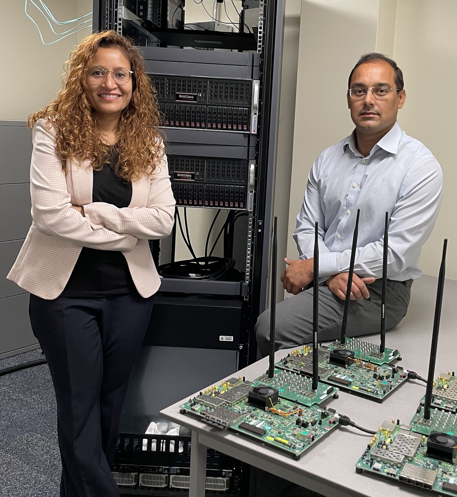 Aveek Dutta and Dola Saha standing in research laboratory