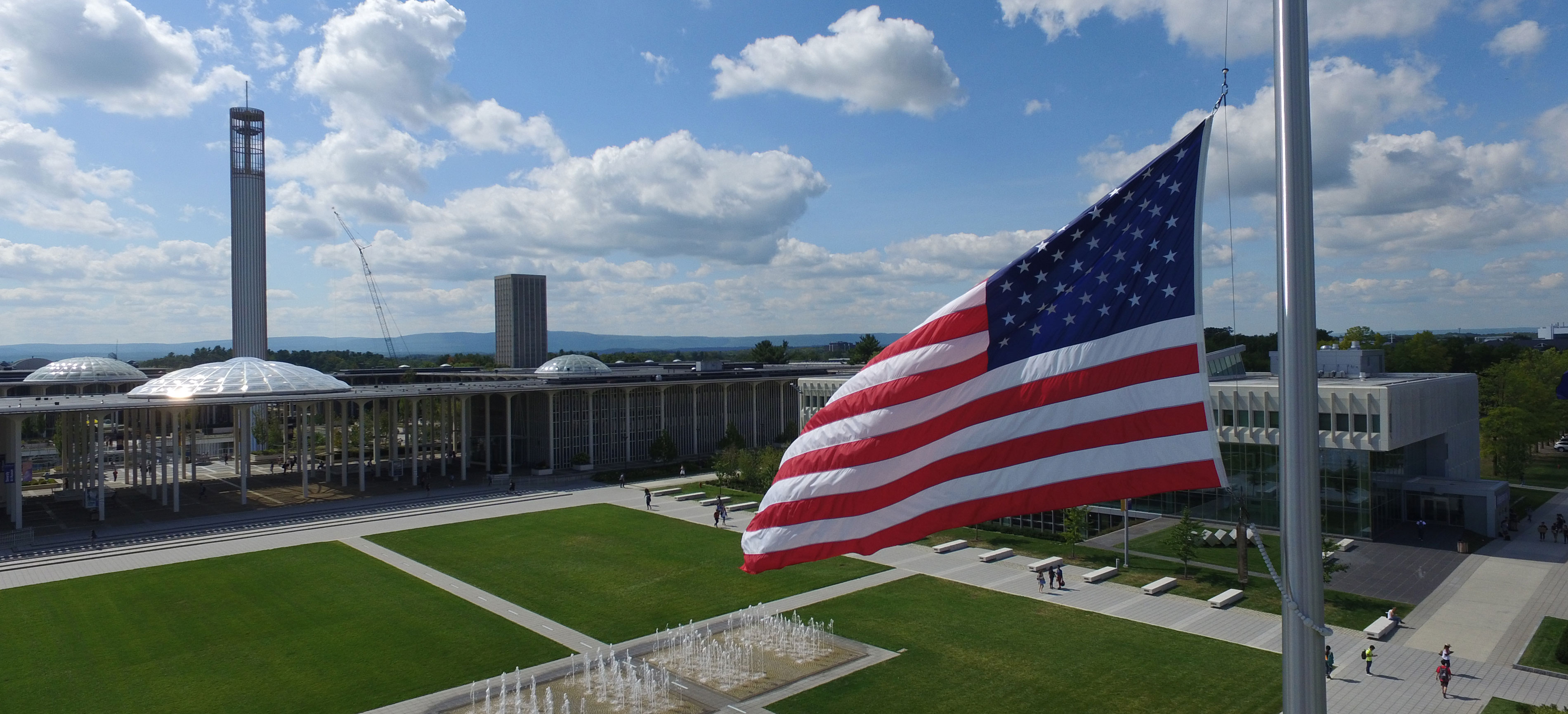 An American flag flying over UAlbany's Academic Podium on the Uptown Campus.