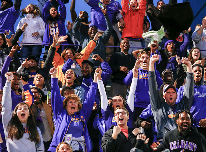 The crowd cheers at a UAlbany football game